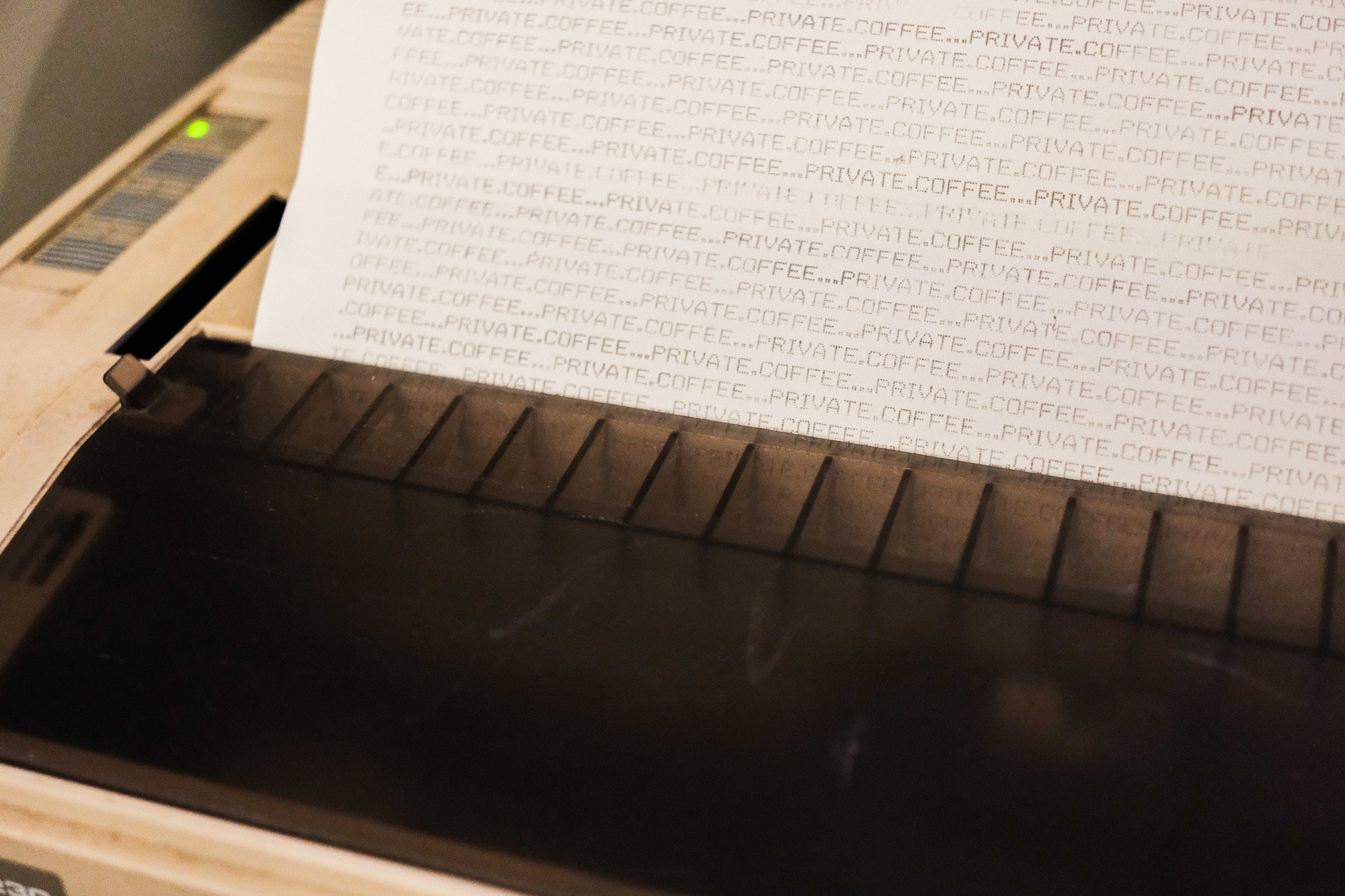 C64 printer with text that repeatetly writes private.coffee...private.coffee...